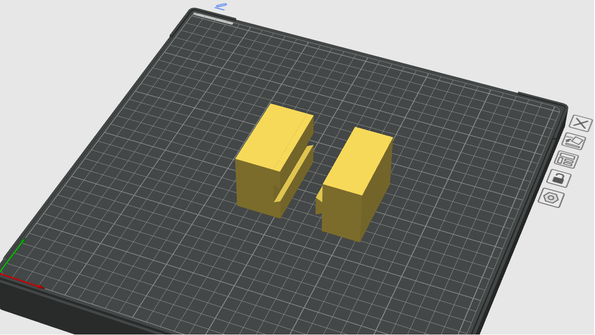 Two yellow rectangular models on QIDI Studio build plate