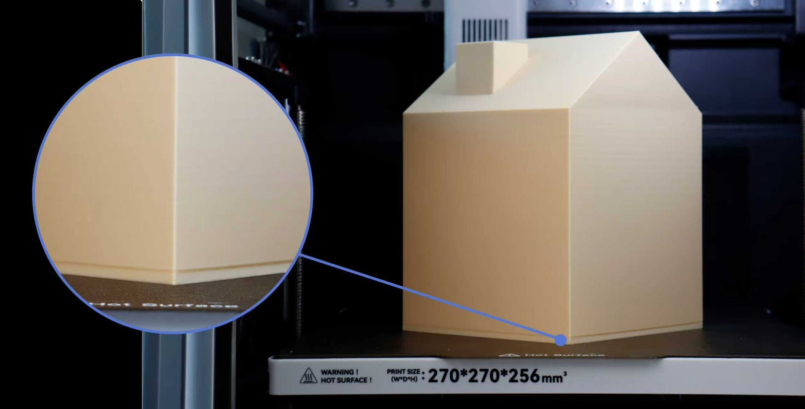 A 3D printed beige house on a printer bed, with a close-up showing the fine detail and sharp edges of a corner