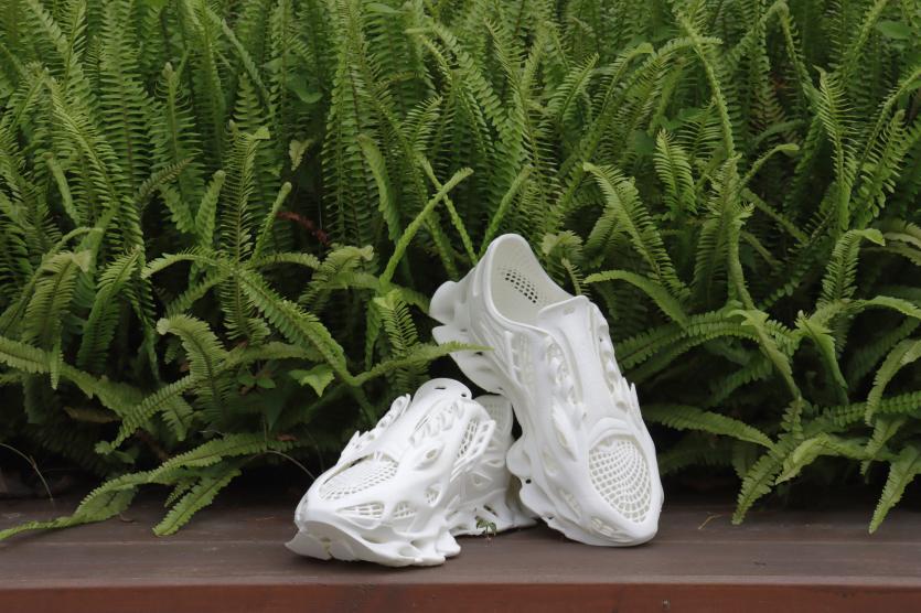 A pair of white 3D printed shoes