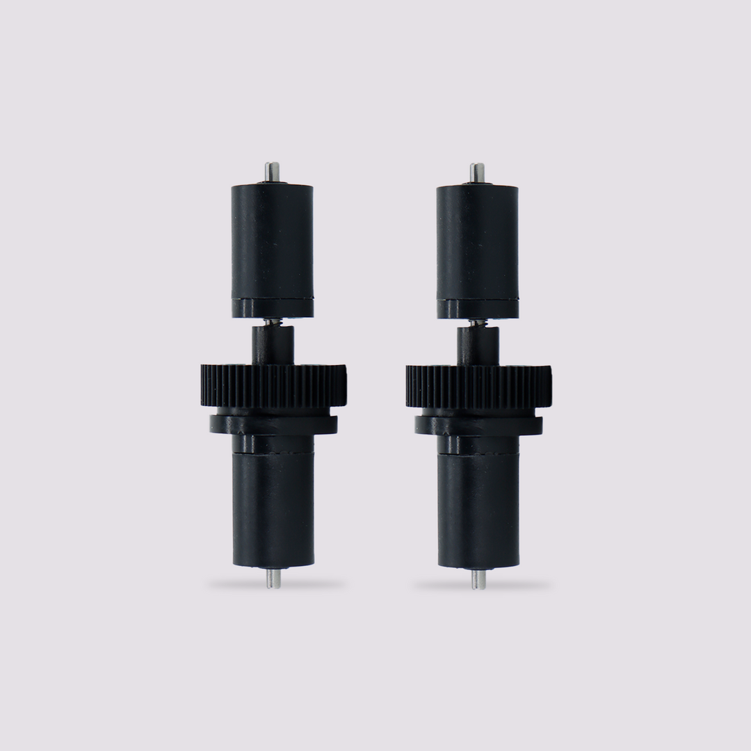 Two QIDI BOX active support shaft assemblies with black gears and cylindrical bodies.