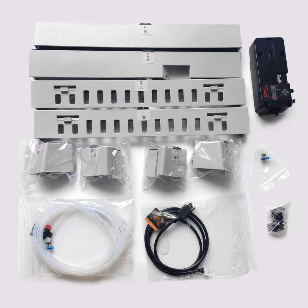 QIDI BOX Upgrade Accessory Kit components including white plastic housing parts, tubing, cables, and a black module.